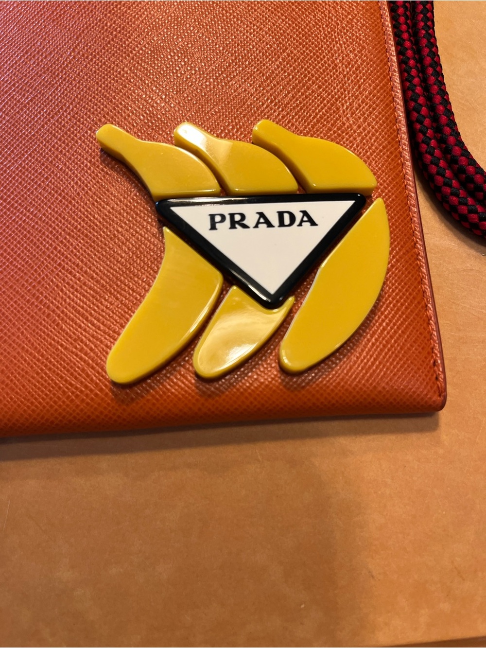 Prada Orange Saffiano Clutch with Yellow Logo Accent